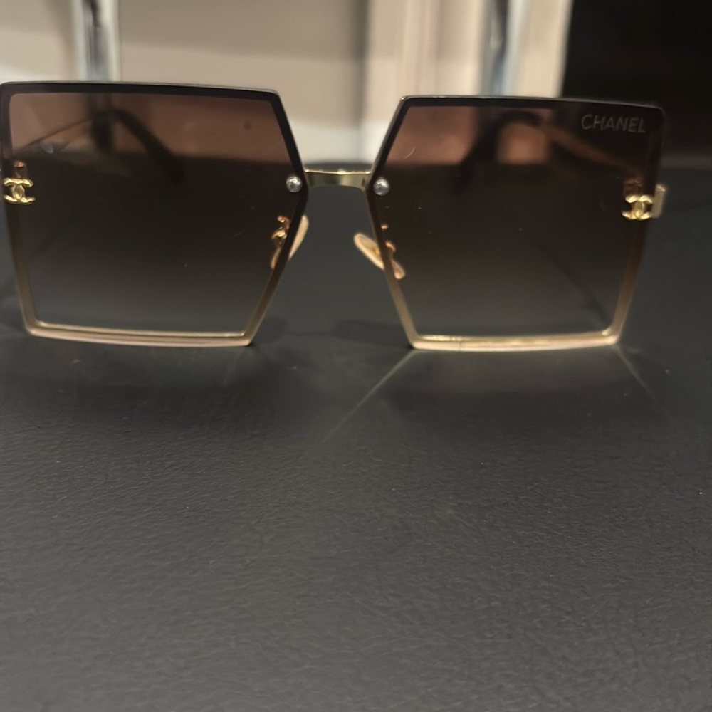 Gold arm sunglasses.